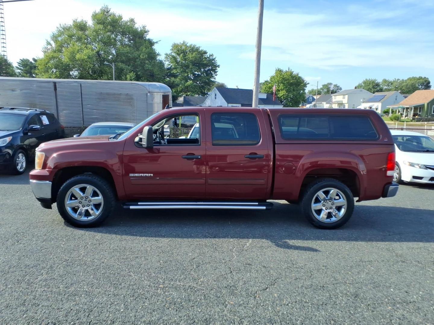 2013 Sonoma Red Metallic GMC Sierra 1500 SLE (3GTP1VE03DG) with an 5.3L 8 Cylinder Sequential-Port F.I. engine, Automatic transmission, located at 50 Eastern Blvd., Essex, MD, 21221, (410) 686-3444, 39.304367, -76.484947- Photo#1