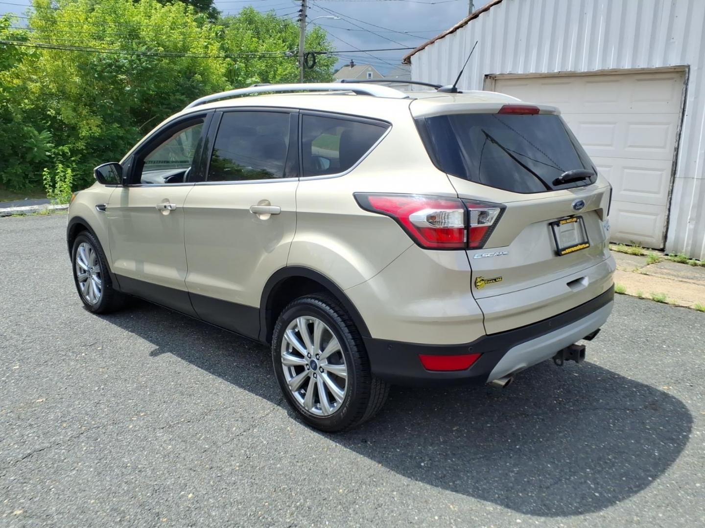 2017 White Gold Ford Escape Titanium (1FMCU9J95HU) with an 2.0L 4 Cylinder Turbocharged engine, ATAWD transmission, located at 50 Eastern Blvd., Essex, MD, 21221, (410) 686-3444, 39.304367, -76.484947- Photo#2