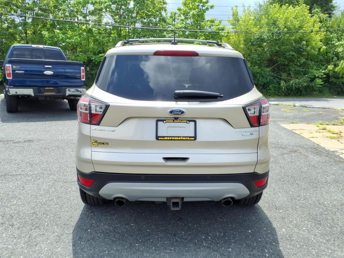2017 White Gold Ford Escape Titanium (1FMCU9J95HU) with an 2.0L 4 Cylinder Turbocharged engine, ATAWD transmission, located at 50 Eastern Blvd., Essex, MD, 21221, (410) 686-3444, 39.304367, -76.484947- Photo#3
