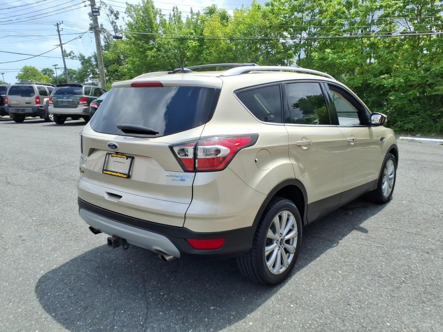 2017 White Gold Ford Escape Titanium (1FMCU9J95HU) with an 2.0L 4 Cylinder Turbocharged engine, ATAWD transmission, located at 50 Eastern Blvd., Essex, MD, 21221, (410) 686-3444, 39.304367, -76.484947- Photo#4