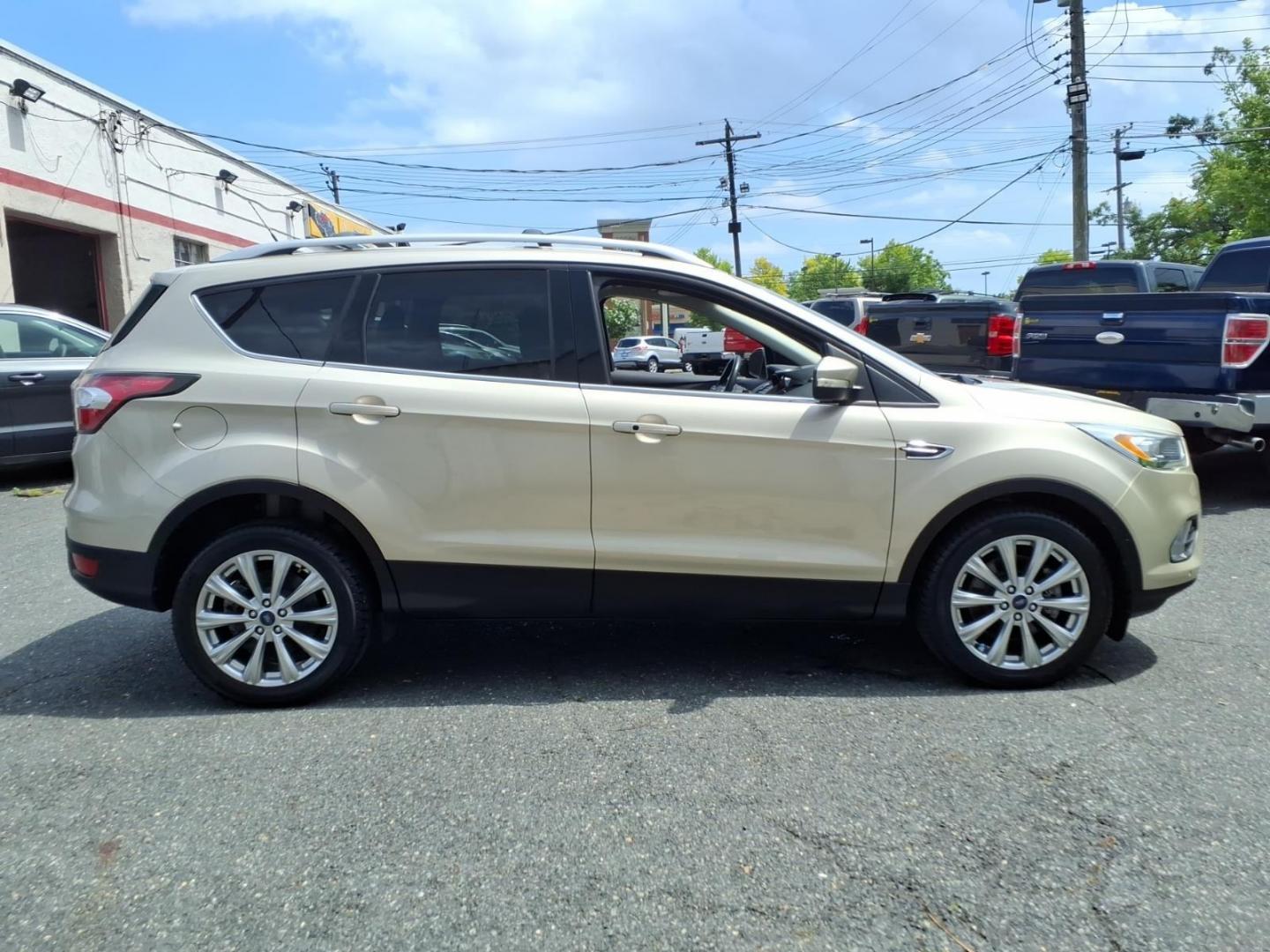 2017 White Gold Ford Escape Titanium (1FMCU9J95HU) with an 2.0L 4 Cylinder Turbocharged engine, ATAWD transmission, located at 50 Eastern Blvd., Essex, MD, 21221, (410) 686-3444, 39.304367, -76.484947- Photo#5