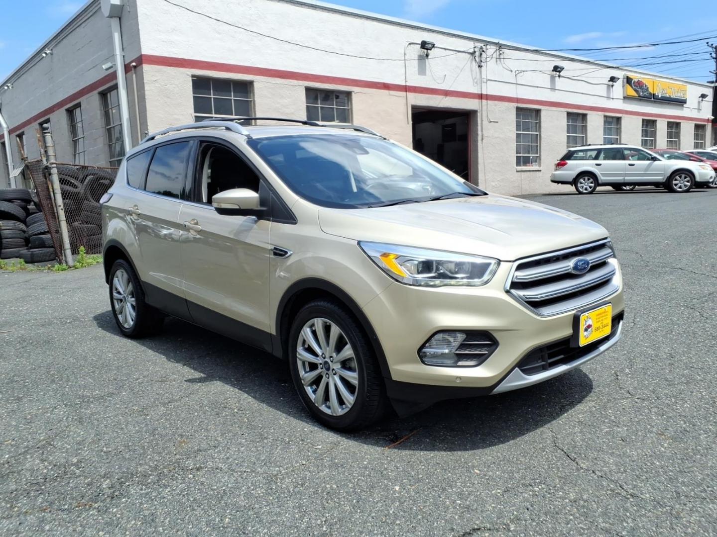 2017 White Gold Ford Escape Titanium (1FMCU9J95HU) with an 2.0L 4 Cylinder Turbocharged engine, ATAWD transmission, located at 50 Eastern Blvd., Essex, MD, 21221, (410) 686-3444, 39.304367, -76.484947- Photo#6