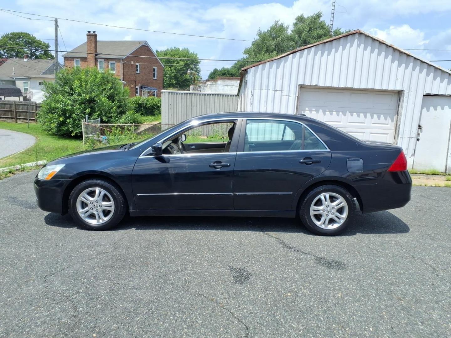 2007 Black Honda Accord EX-L (1HGCM56837A) with an 2.4L 2.4L inline 4 double overhead camshaft 16V Sequential-Port F.I. engine, 5-Speed Automatic transmission, located at 50 Eastern Blvd., Essex, MD, 21221, (410) 686-3444, 39.304367, -76.484947- Photo#1