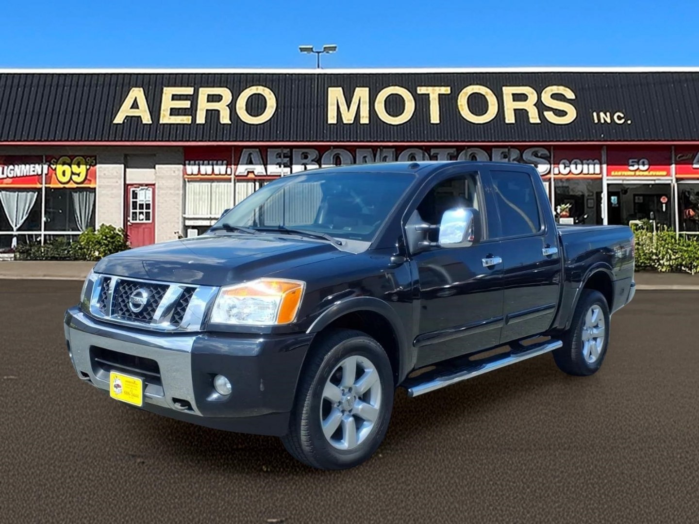 2014 Black Nissan Titan SL (1N6AA0EC6EN) with an 5.6L 8 Cylinder Fuel Injected engine, AT4X4 transmission, located at 50 Eastern Blvd., Essex, MD, 21221, (410) 686-3444, 39.304367, -76.484947- Photo#0