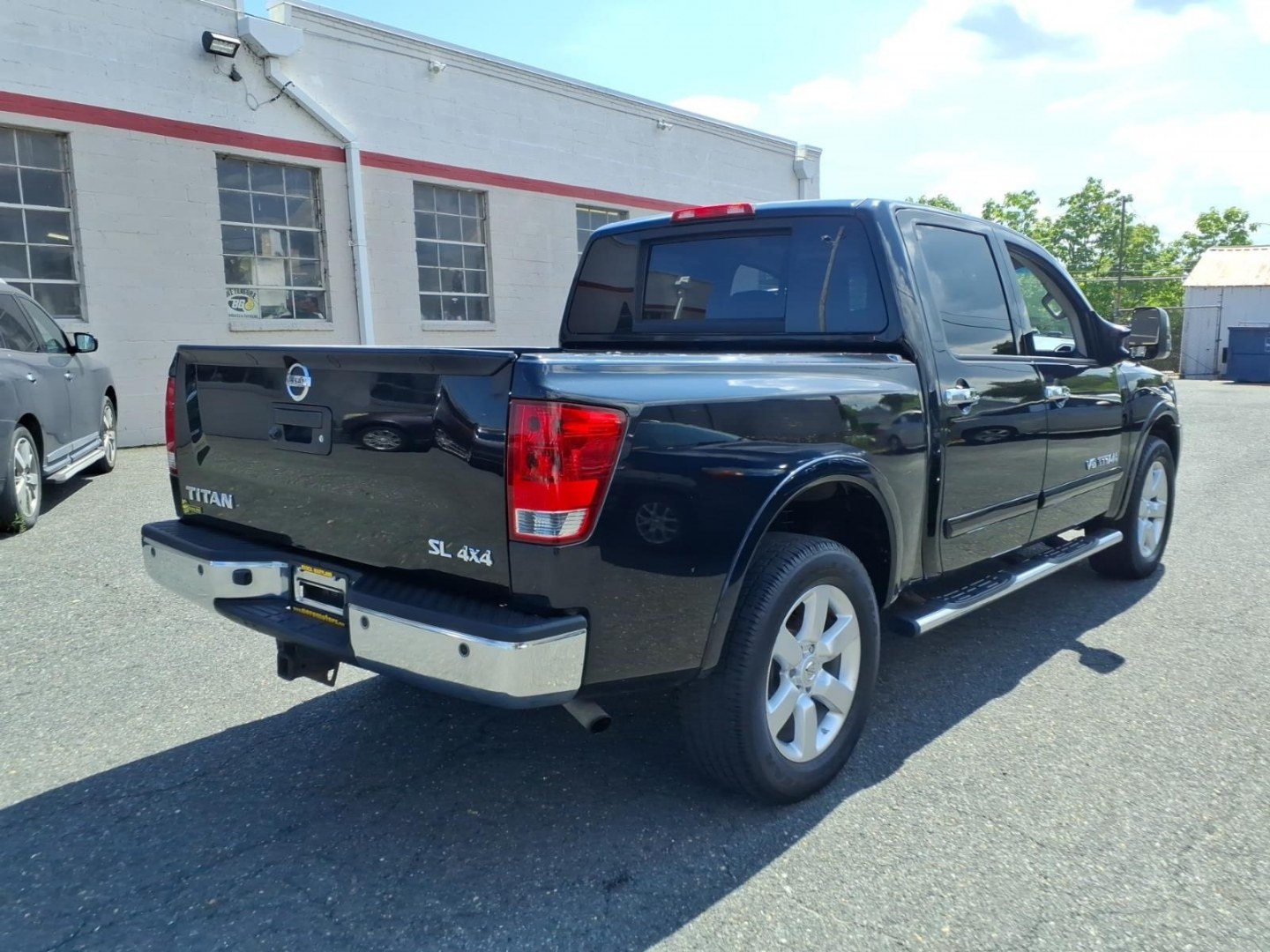 2014 Black Nissan Titan SL (1N6AA0EC6EN) with an 5.6L 8 Cylinder Fuel Injected engine, AT4X4 transmission, located at 50 Eastern Blvd., Essex, MD, 21221, (410) 686-3444, 39.304367, -76.484947- Photo#3