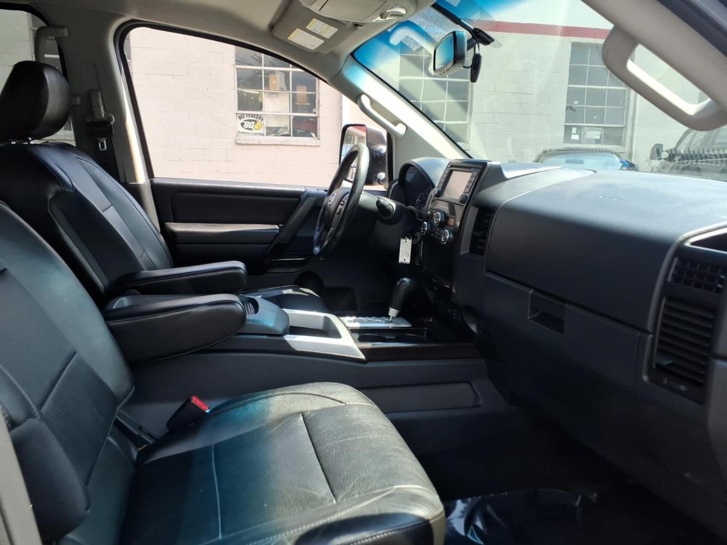 2014 Black Nissan Titan SL (1N6AA0EC6EN) with an 5.6L 8 Cylinder Fuel Injected engine, AT4X4 transmission, located at 50 Eastern Blvd., Essex, MD, 21221, (410) 686-3444, 39.304367, -76.484947- Photo#10