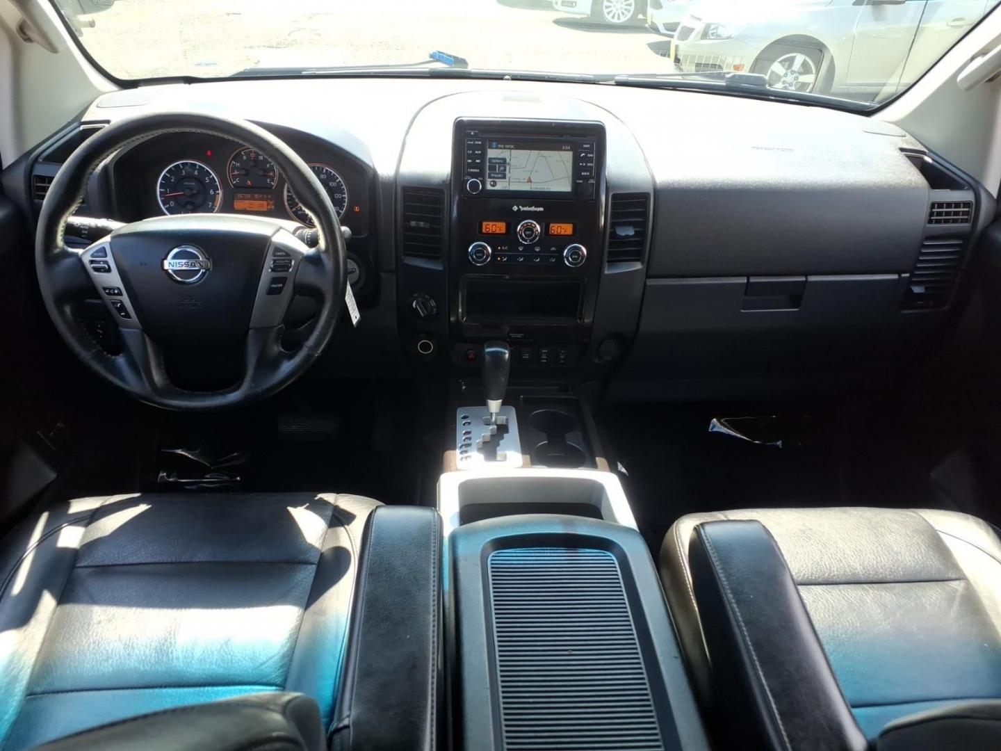 2014 Black Nissan Titan SL (1N6AA0EC6EN) with an 5.6L 8 Cylinder Fuel Injected engine, AT4X4 transmission, located at 50 Eastern Blvd., Essex, MD, 21221, (410) 686-3444, 39.304367, -76.484947- Photo#13