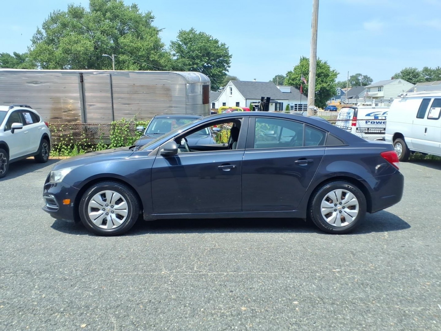 2015 Blue Chevrolet Cruze LS Auto (1G1PA5SG5F7) with an 1.8L 4 Cylinder Sequential-Port F.I. engine, Automatic transmission, located at 50 Eastern Blvd., Essex, MD, 21221, (410) 686-3444, 39.304367, -76.484947- Photo#1