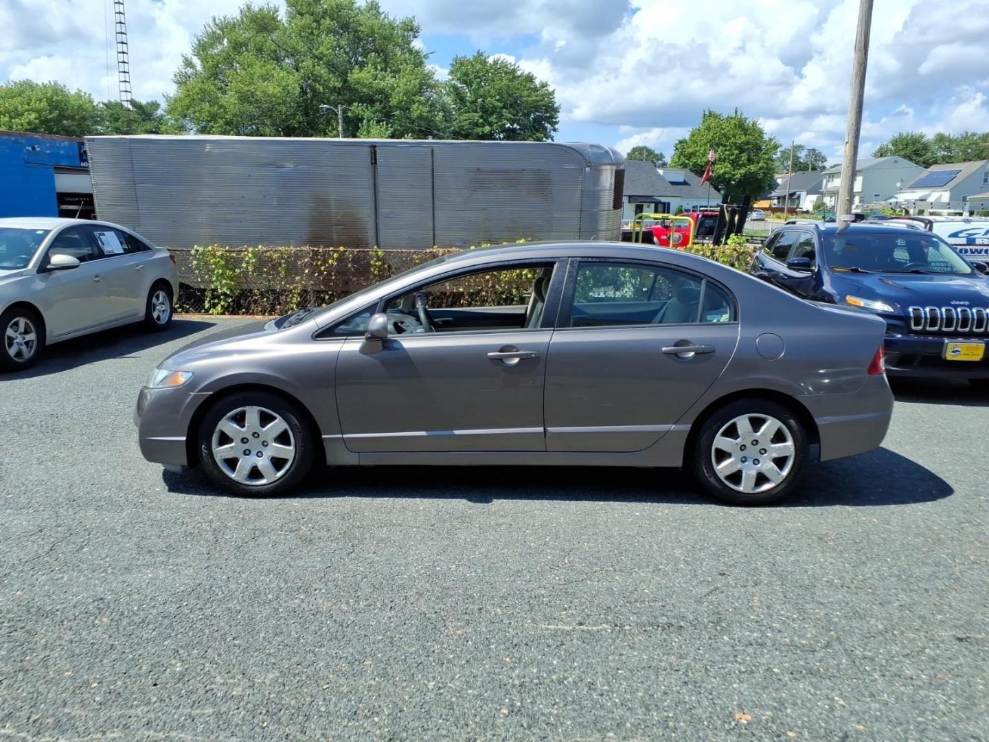 2009 Polished Metal Metallic Honda Civic LX (1HGFA16529L) with an 1.8L 4 Cylinder Fuel Injected engine, Automatic transmission, located at 50 Eastern Blvd., Essex, MD, 21221, (410) 686-3444, 39.304367, -76.484947- Photo#1