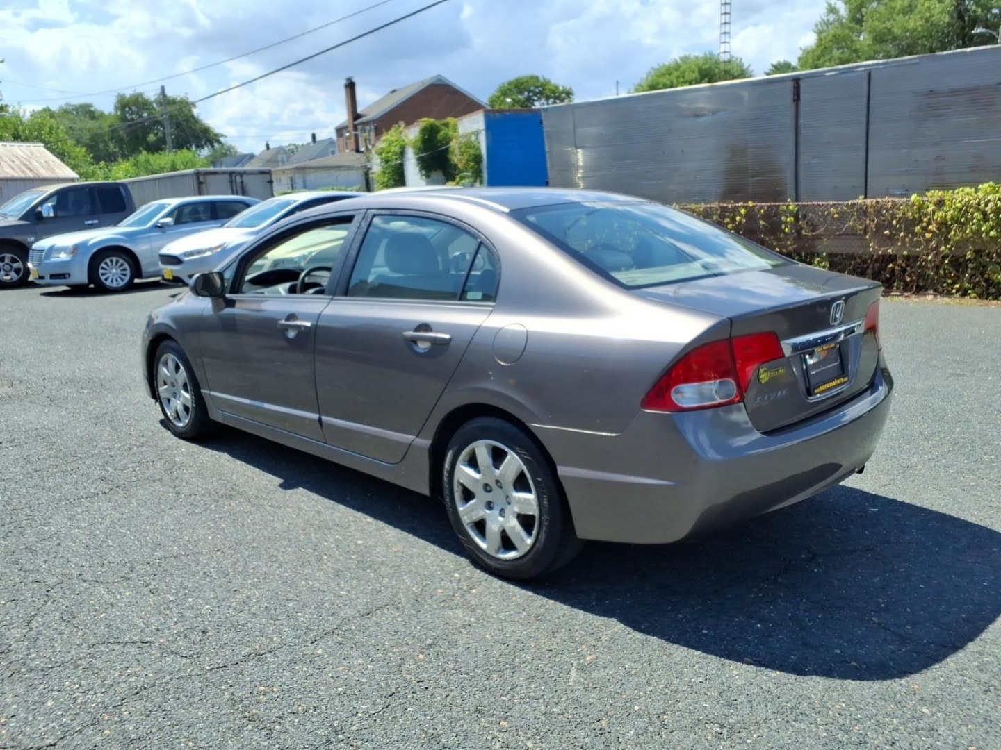 2009 Polished Metal Metallic Honda Civic LX (1HGFA16529L) with an 1.8L 4 Cylinder Fuel Injected engine, Automatic transmission, located at 50 Eastern Blvd., Essex, MD, 21221, (410) 686-3444, 39.304367, -76.484947- Photo#2