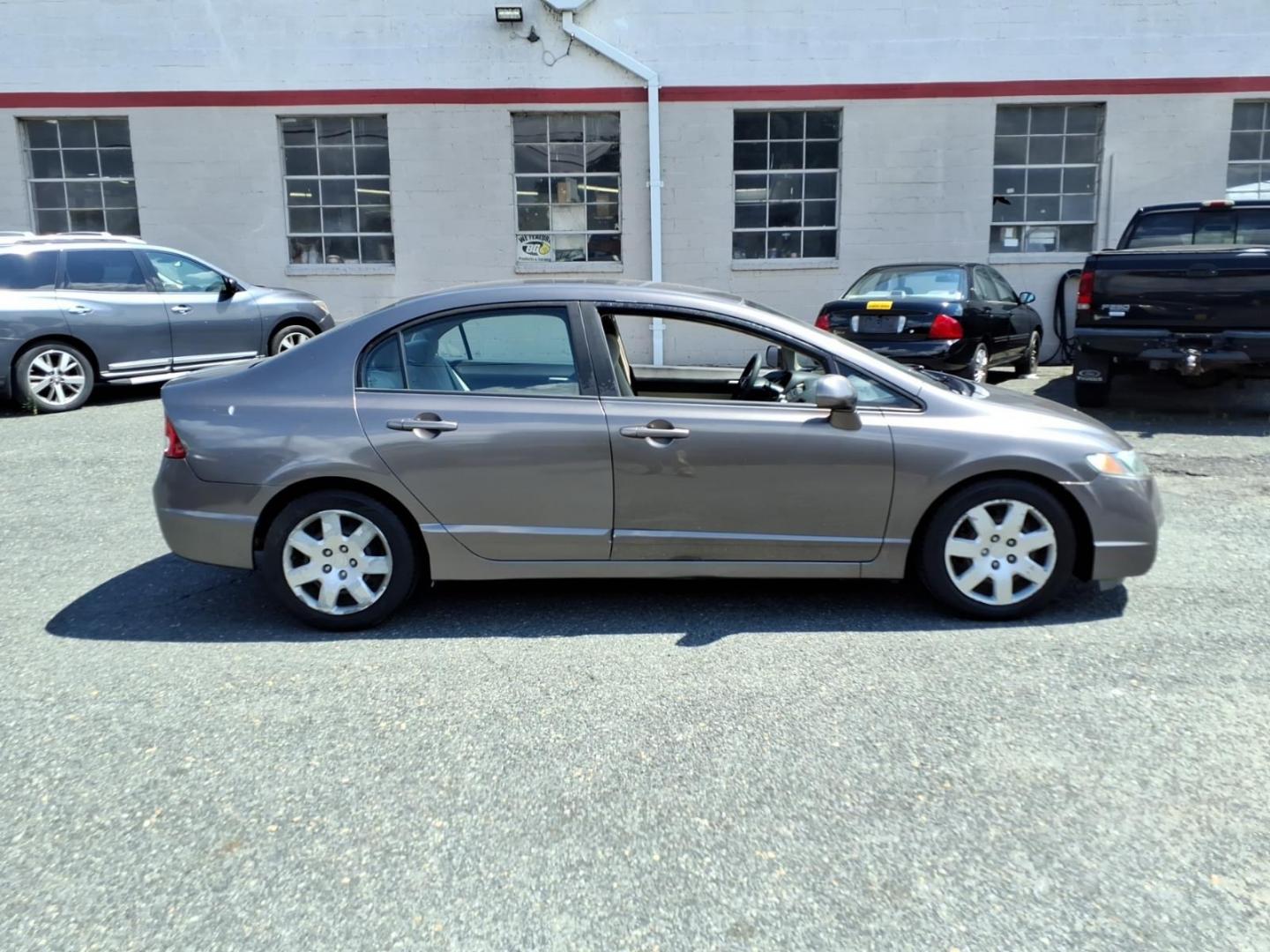 2009 Polished Metal Metallic Honda Civic LX (1HGFA16529L) with an 1.8L 4 Cylinder Fuel Injected engine, Automatic transmission, located at 50 Eastern Blvd., Essex, MD, 21221, (410) 686-3444, 39.304367, -76.484947- Photo#4
