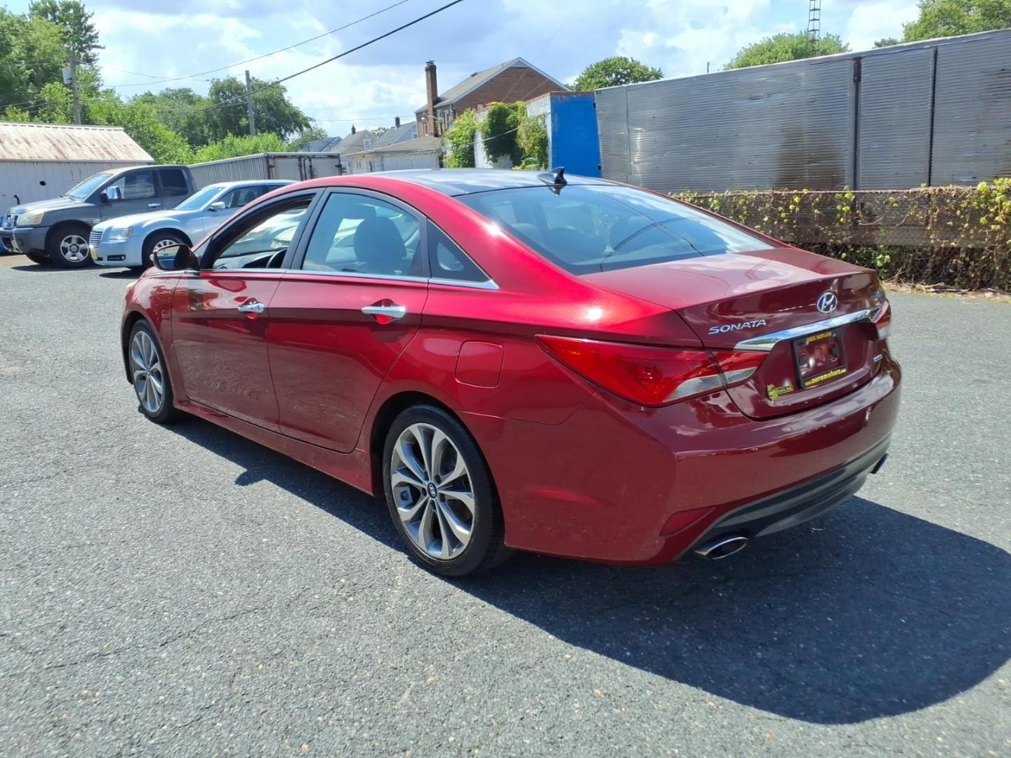 2014 Venetian Red Hyundai SONATA Limited 2.0T (5NPEC4AB5EH) with an 2.0L 4 Cylinder Turbocharged engine, Automatic transmission, located at 50 Eastern Blvd., Essex, MD, 21221, (410) 686-3444, 39.304367, -76.484947- Photo#2