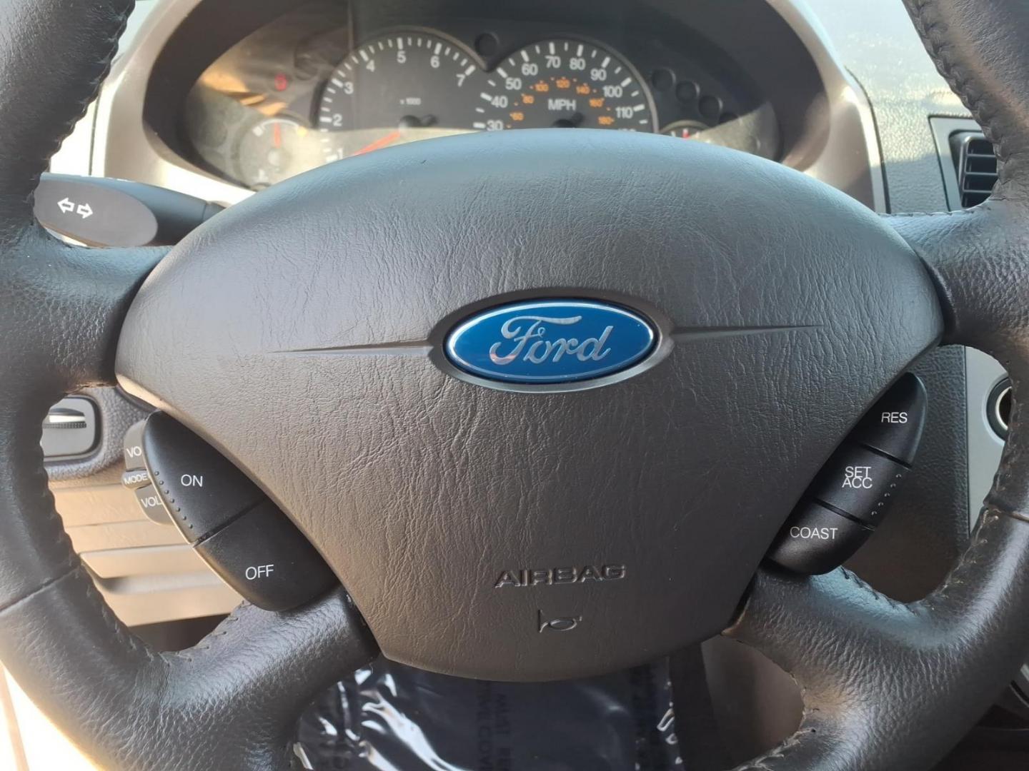 2007 Cloud 9 White Clearcoat Yz Ford Focus ZX5 SE (1FAHP37N27W) with an 2.0L 2.0L inline 4 double overhead camshaft 16V Fuel Injected engine, Automatic transmission, located at 50 Eastern Blvd., Essex, MD, 21221, (410) 686-3444, 39.304367, -76.484947- Photo#17