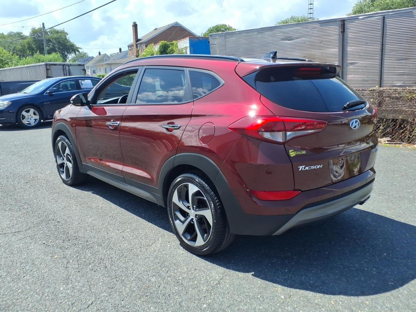 2016 Red Hyundai TUCSON Limited (KM8J3CA26GU) with an 1.6L 4 Cylinder Turbocharged engine, ATAWD transmission, located at 50 Eastern Blvd., Essex, MD, 21221, (410) 686-3444, 39.304367, -76.484947- Photo#2