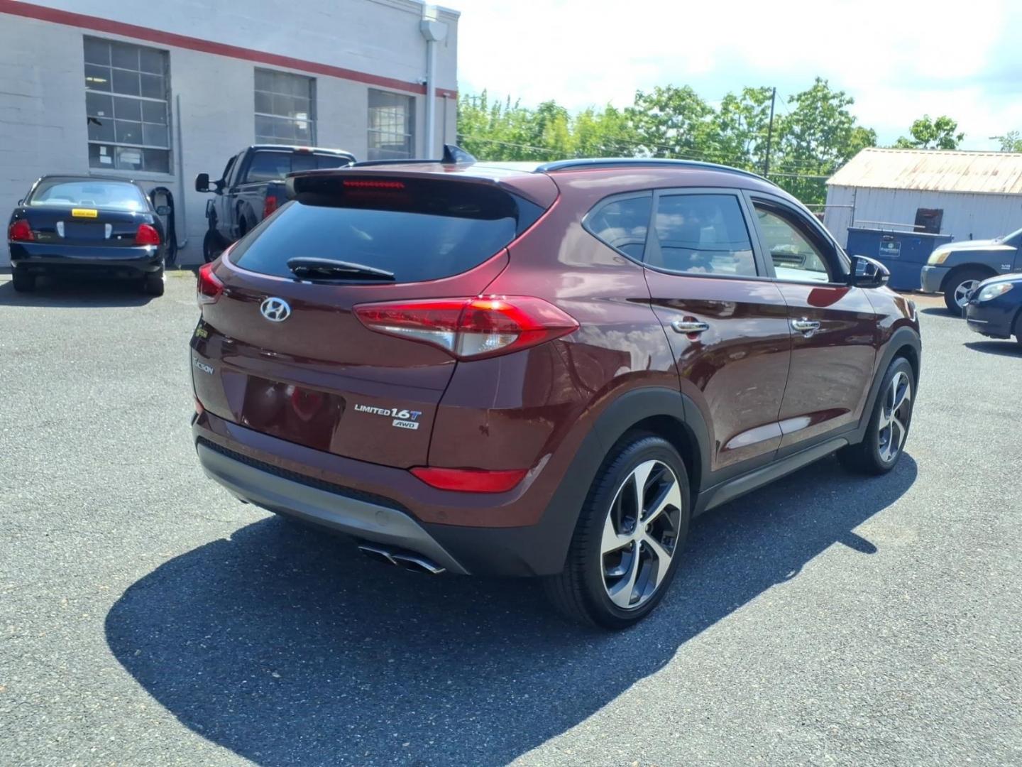 2016 Red Hyundai TUCSON Limited (KM8J3CA26GU) with an 1.6L 4 Cylinder Turbocharged engine, ATAWD transmission, located at 50 Eastern Blvd., Essex, MD, 21221, (410) 686-3444, 39.304367, -76.484947- Photo#3