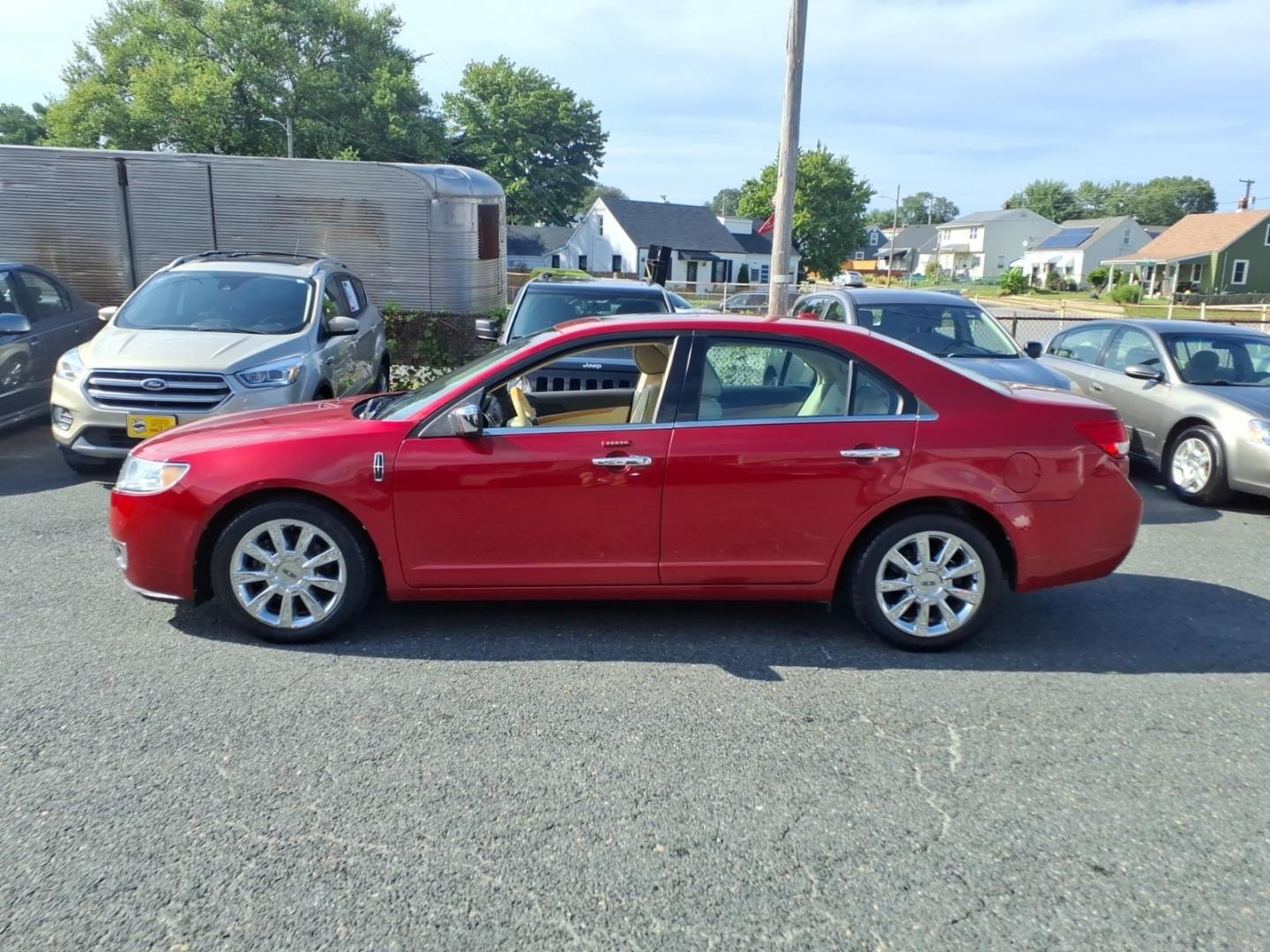 2011 Red Lincoln MKZ Base (3LNHL2GC9BR) with an 3.5L 6 Cylinder Sequential-Port F.I. engine, ATV6 transmission, located at 50 Eastern Blvd., Essex, MD, 21221, (410) 686-3444, 39.304367, -76.484947- Photo#1