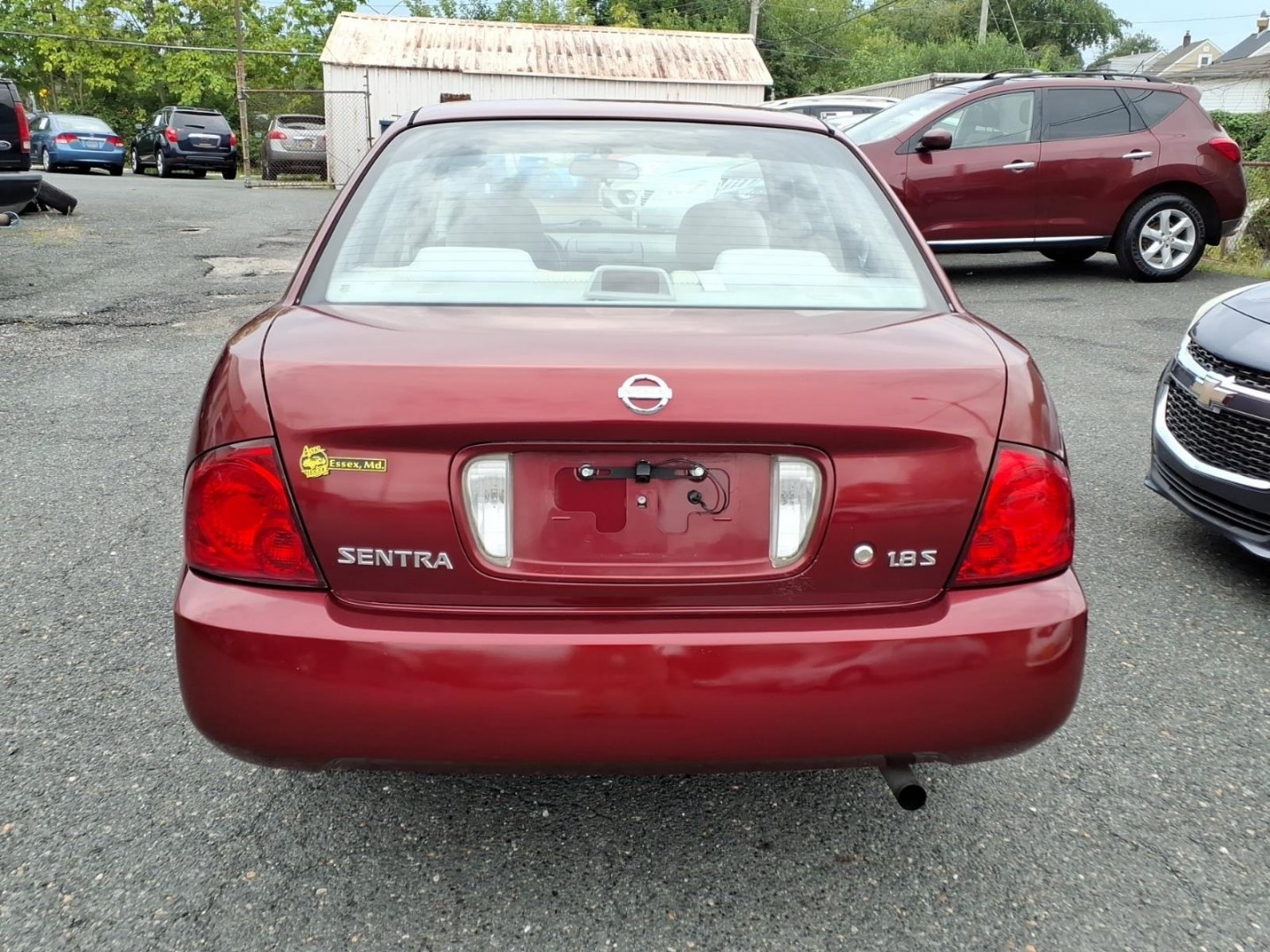 2005 Code Red Nissan Sentra 1.8 S (3N1CB51D55L) with an 1.8L 1L NA I4 double overhead cam (DOHC) 16V Fuel Injected engine, 4-Speed Automatic transmission, located at 50 Eastern Blvd., Essex, MD, 21221, (410) 686-3444, 39.304367, -76.484947- Photo#3
