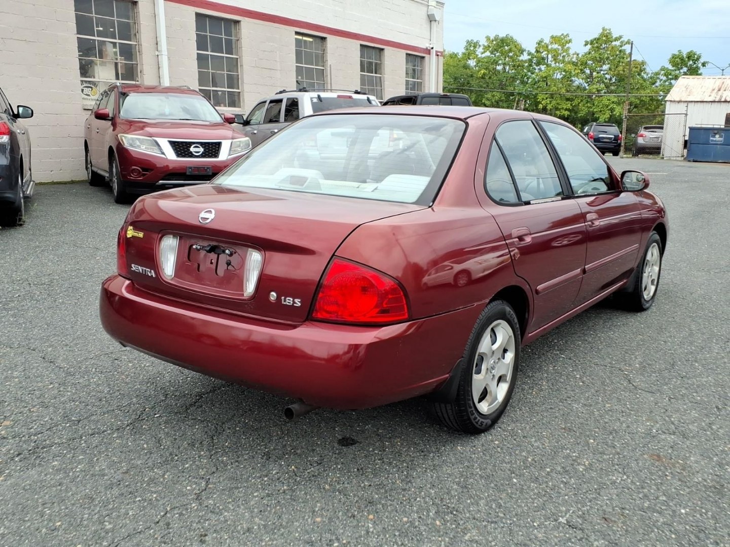 2005 Code Red Nissan Sentra 1.8 S (3N1CB51D55L) with an 1.8L 1L NA I4 double overhead cam (DOHC) 16V Fuel Injected engine, 4-Speed Automatic transmission, located at 50 Eastern Blvd., Essex, MD, 21221, (410) 686-3444, 39.304367, -76.484947- Photo#4