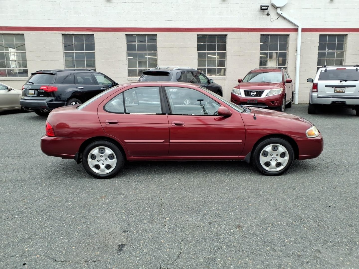 2005 Code Red Nissan Sentra 1.8 S (3N1CB51D55L) with an 1.8L 1L NA I4 double overhead cam (DOHC) 16V Fuel Injected engine, 4-Speed Automatic transmission, located at 50 Eastern Blvd., Essex, MD, 21221, (410) 686-3444, 39.304367, -76.484947- Photo#5