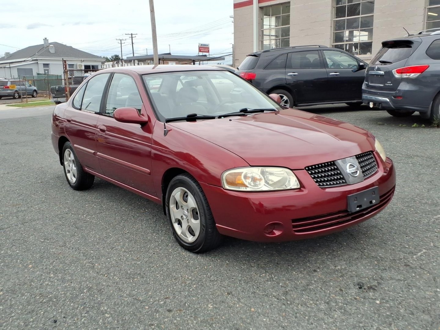2005 Code Red Nissan Sentra 1.8 S (3N1CB51D55L) with an 1.8L 1L NA I4 double overhead cam (DOHC) 16V Fuel Injected engine, 4-Speed Automatic transmission, located at 50 Eastern Blvd., Essex, MD, 21221, (410) 686-3444, 39.304367, -76.484947- Photo#6