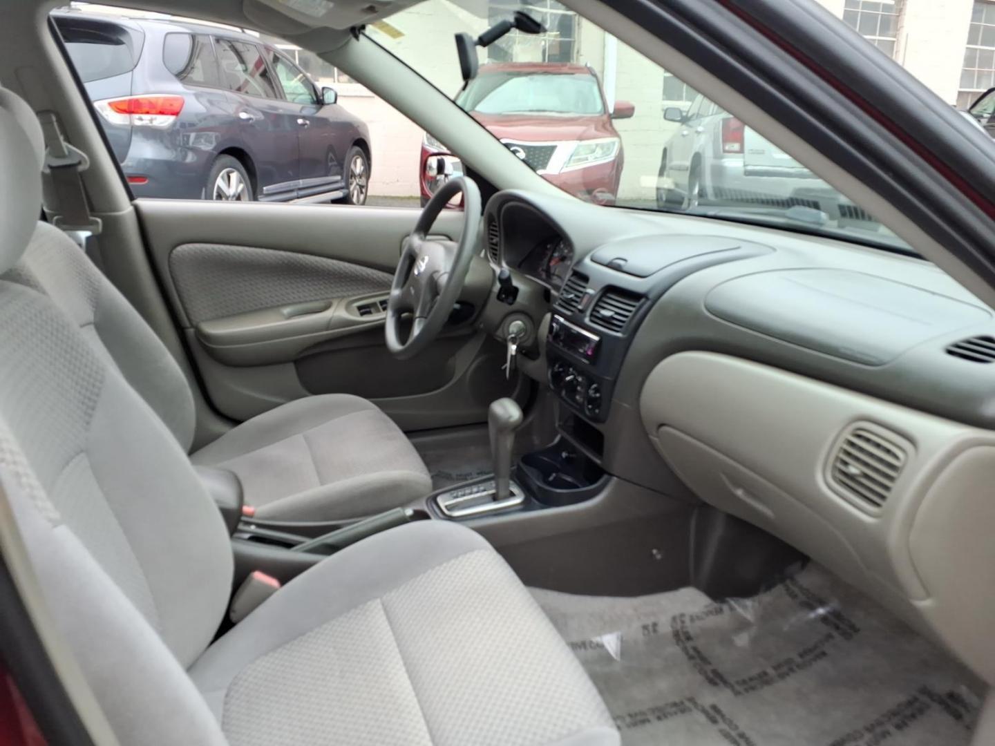 2005 Code Red Nissan Sentra 1.8 S (3N1CB51D55L) with an 1.8L 1L NA I4 double overhead cam (DOHC) 16V Fuel Injected engine, 4-Speed Automatic transmission, located at 50 Eastern Blvd., Essex, MD, 21221, (410) 686-3444, 39.304367, -76.484947- Photo#13