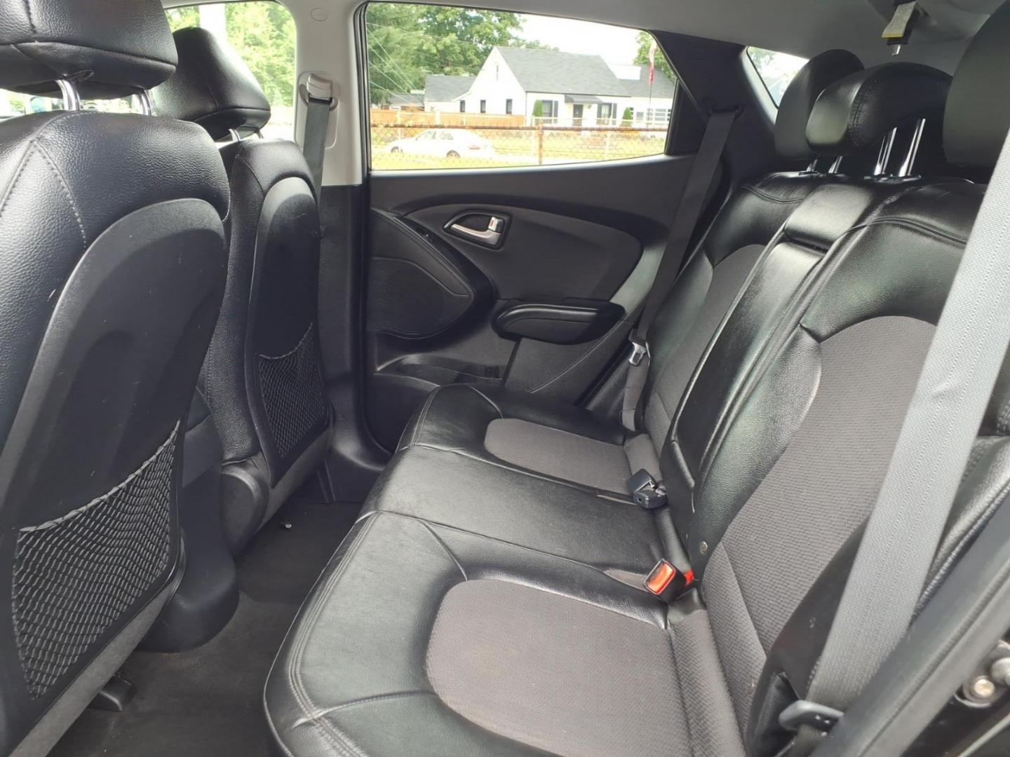 2012 Black Hyundai TUCSON GLS (KM8JUCAC5CU) with an 2.4L 4 Cylinder Sequential-Port F.I. engine, Automatic transmission, located at 50 Eastern Blvd., Essex, MD, 21221, (410) 686-3444, 39.304367, -76.484947- Photo#10