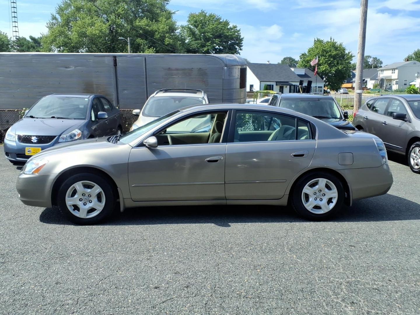 2002 Velvet Beige Nissan Altima 2.5 S (1N4AL11E02C) with an 2.5L 2L NA I4 double overhead cam (DOHC) 16V Fuel Injected engine, Automatic transmission, located at 50 Eastern Blvd., Essex, MD, 21221, (410) 686-3444, 39.304367, -76.484947- Photo#1