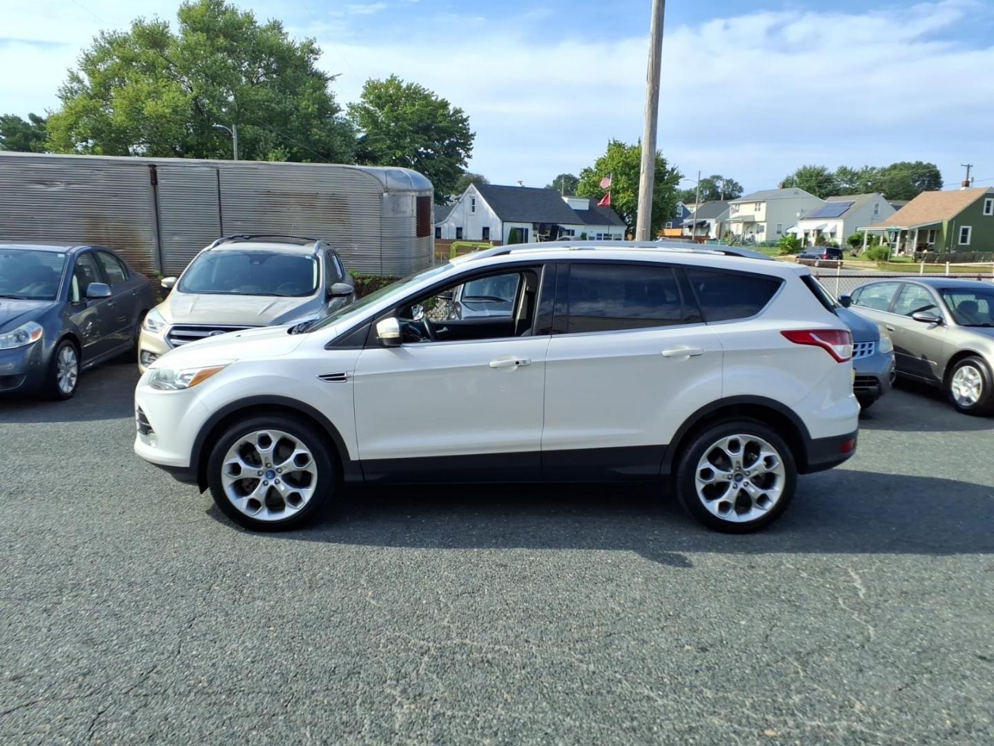 2013 White Platinum Metallic Tri-Coat Ford Escape Titanium (1FMCU0J91DU) with an 2.0L 4 Cylinder Turbocharged engine, AT4X4 transmission, located at 50 Eastern Blvd., Essex, MD, 21221, (410) 686-3444, 39.304367, -76.484947- Photo#1