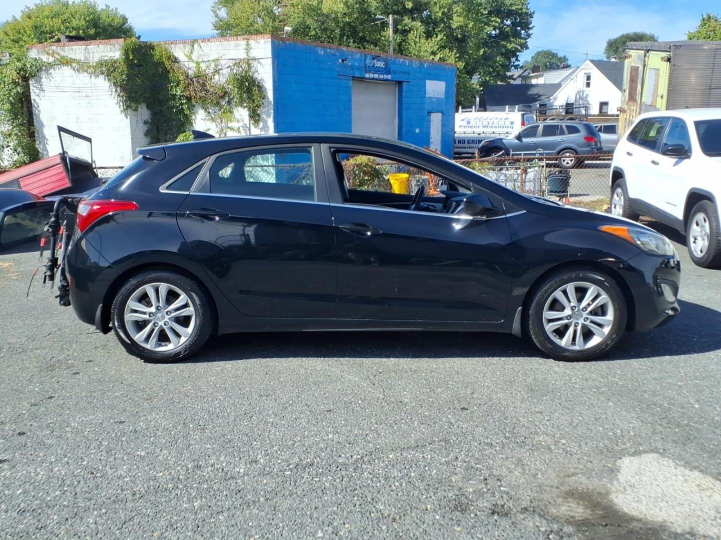 2013 Black Hyundai ELANTRA GT Base (KMHD35LE9DU) with an 1.8L 4 Cylinder Sequential Fuel Injection engine, Automatic transmission, located at 50 Eastern Blvd., Essex, MD, 21221, (410) 686-3444, 39.304367, -76.484947- Photo#5