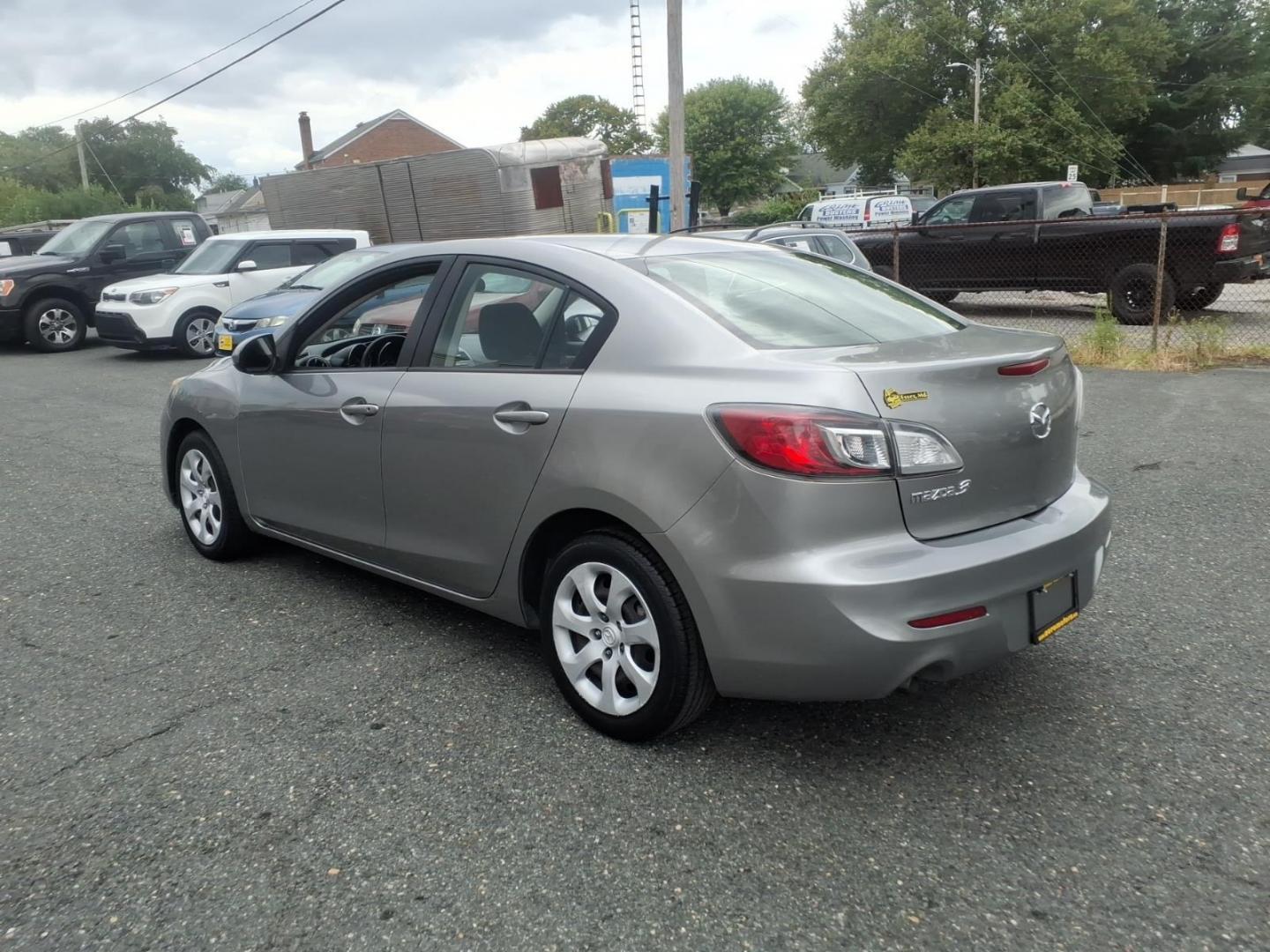 2013 Liquid Silver Metallic Mazda Mazda3 i SV (JM1BL1TF1D1) with an 2.0L 4 Cylinder Fuel Injected engine, Automatic transmission, located at 50 Eastern Blvd., Essex, MD, 21221, (410) 686-3444, 39.304367, -76.484947- Photo#2