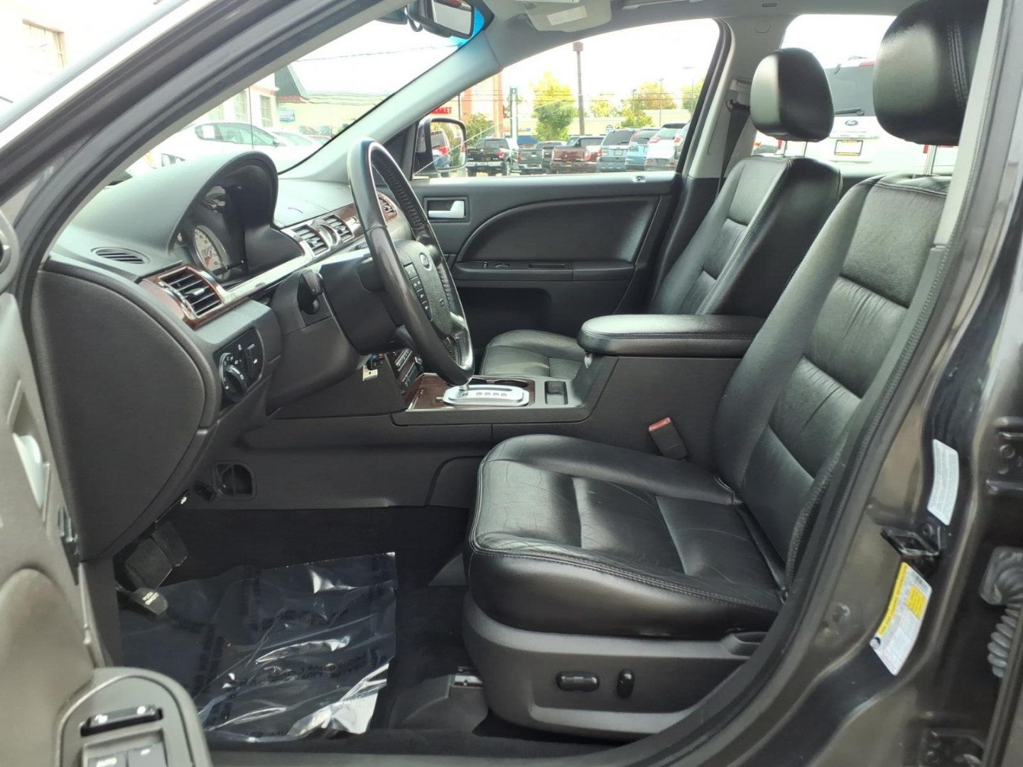 2007 Black Ford Five Hundred Limited (1FAHP28137G) with an 3.0L 6 Cylinder Fuel Injected engine, Automatic transmission, located at 50 Eastern Blvd., Essex, MD, 21221, (410) 686-3444, 39.304367, -76.484947- Photo#6