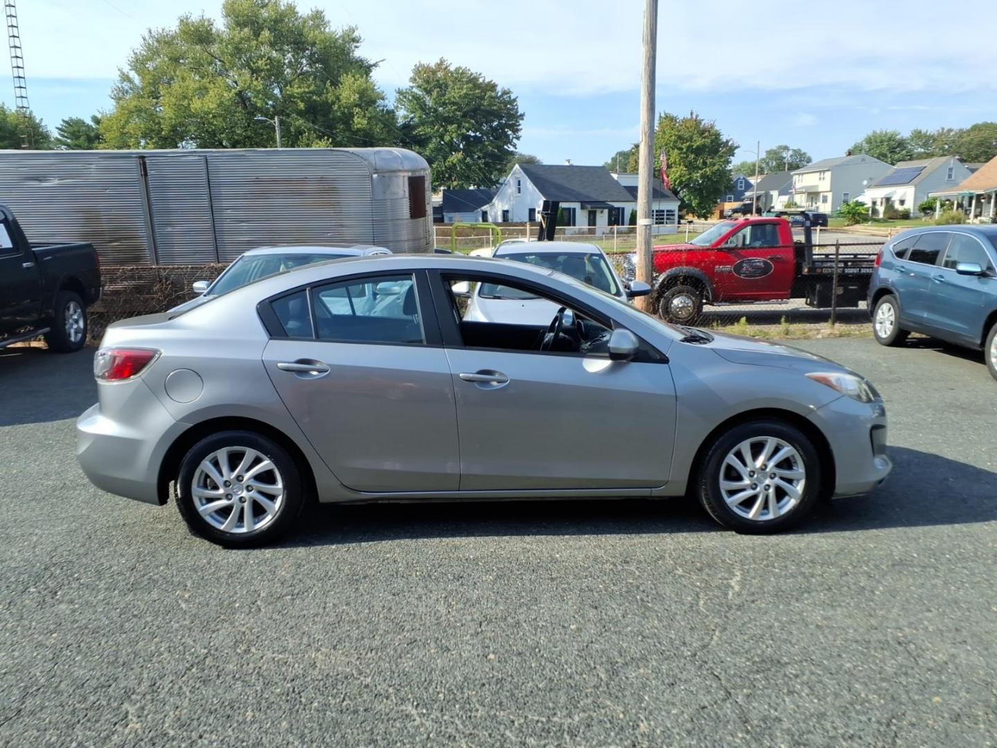 2012 Grey Mazda Mazda3 i Touring (JM1BL1VG3C1) with an 2.0L 4 Cylinder Sequential-Port F.I. engine, Automatic transmission, located at 50 Eastern Blvd., Essex, MD, 21221, (410) 686-3444, 39.304367, -76.484947- Photo#5